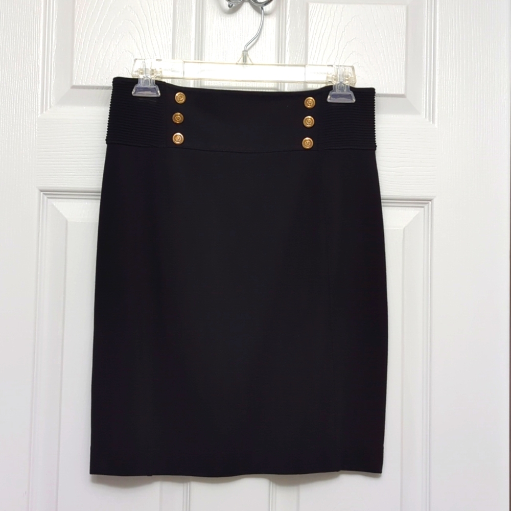 Women's size 6 Express black skirt with gold button detail.
